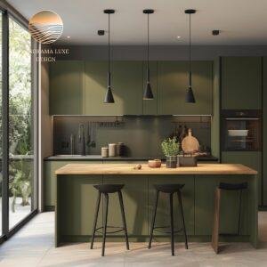 Modern kitchen with olive green cabinets, wood countertop island, and black pendant lights.