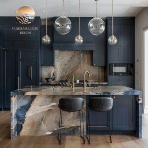 Kitchen featuring navy cabinets and an earthy, vein-rich island countertop with beige and blue tones.
