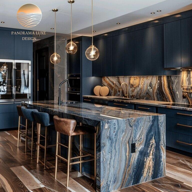 Navy and wood kitchen with polished stone island, dark veining, and gold hardware.