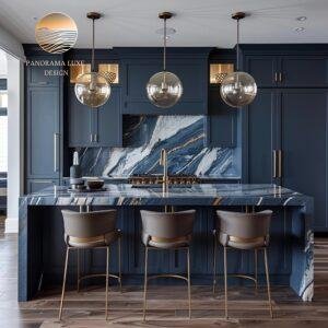 Modern kitchen featuring a sculptural waterfall island in blue, white, and bronze veining with navy cabinetry.