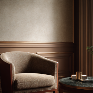 Bouclé accent chair next to a green marble table with warm metal details and layered drapery in soft neutrals.