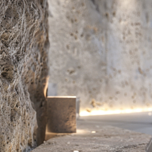 Textured stone wall with integrated lighting in a modern luxury interior