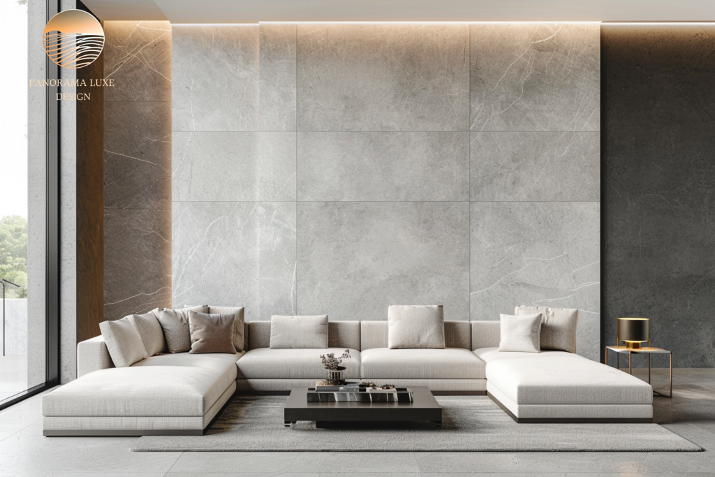 Minimal luxury living room with low sectional sofa, textured stone wall, and warm cove lighting